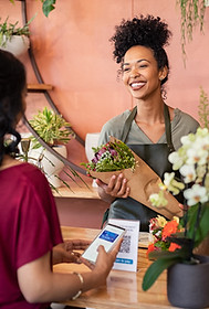 Florist Speaking to a customer in a shop.jpg