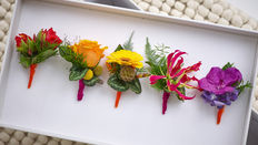 a line of wired button hole bouquets