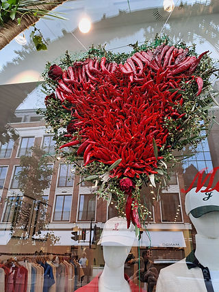 Capsicum used in a window dressing heart design at Chelsea in Bloom