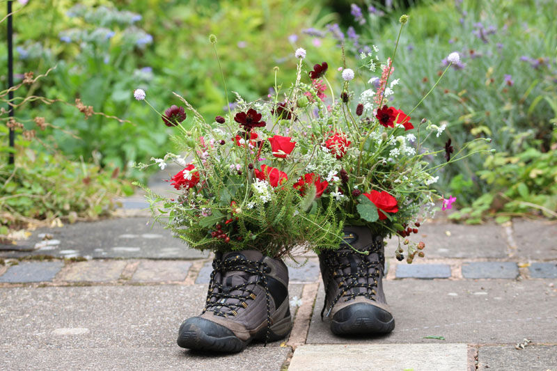 Funeral flowers in walking boots